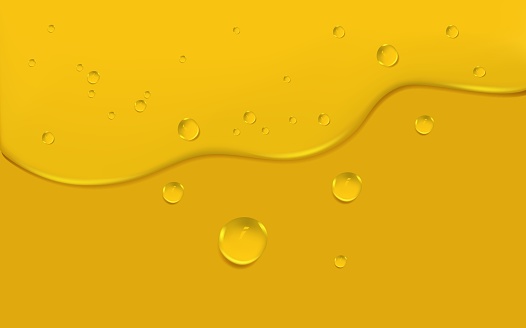 Background with spreading yellow petrol spots.Set of liquid golden drops of water, honey or oil. Collagen cosmetic essence. Organic serum or argan bubbles.