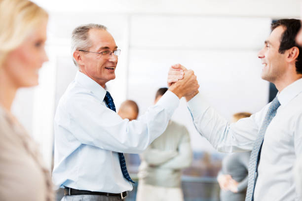 istock Business people congratulating each other 169943448