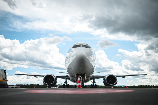 Airplane parked at the airport. Parked perfectly on the spot.