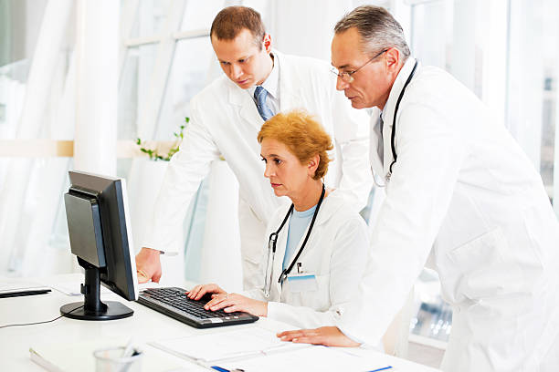 istock Group of a doctors checking Results. 169943690