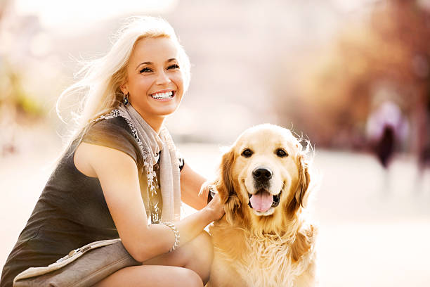 istock Smiling blonde female and her dog. 169943738