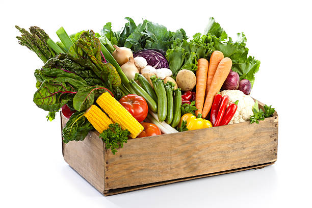 istock Crate filled with assortment of  organic vegetables on white backdrop 169944429