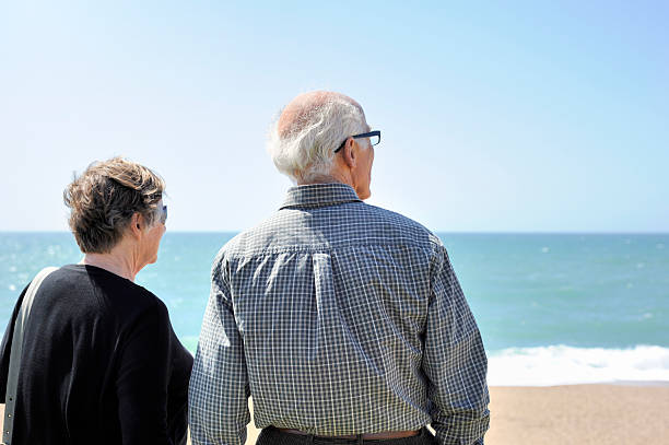 istock Senior Couple Look Out to Sea 169944774