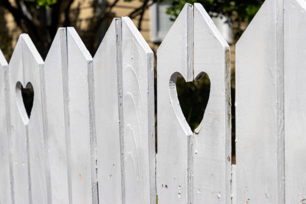 istock Heart shaped holes in fence 1699449311
