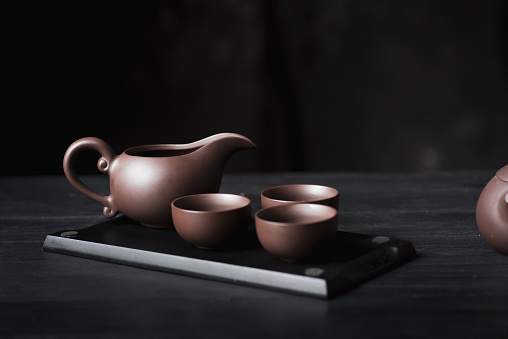 Tea ceremony. Traditional Asian tea set, authentic serving set on dark background