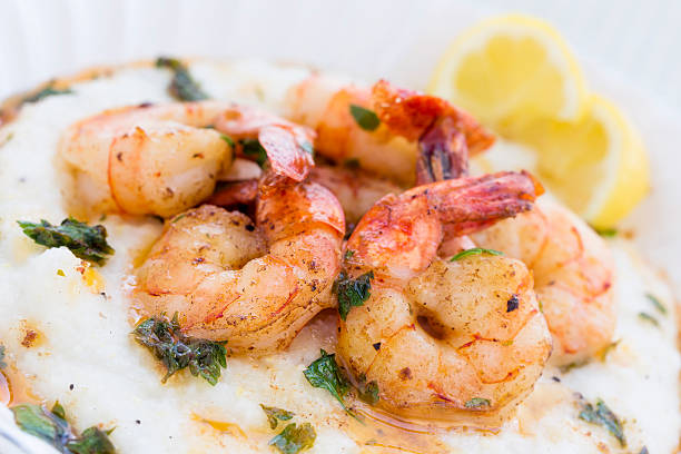 istock Elegant shrimp and grits served on white plate  169946610