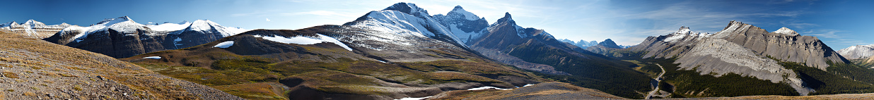 A late-summer panoramic view to the North from Parker Ridge in Canada's Rocky Mountains. Mount Athabasca, Hilda, and Nigel Peaks visible, as well as a portion of the Icefields Parkway. Shot as an ultra-high-resolution composite of 20 images.