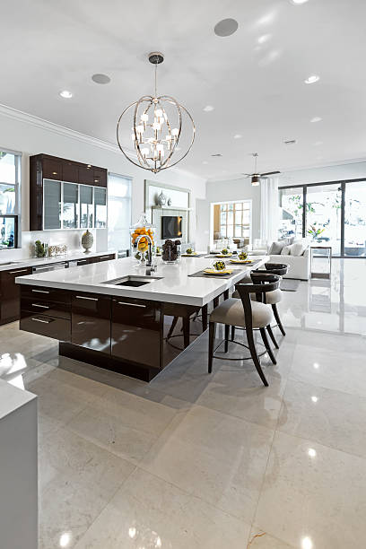 a clean and shiny modern kitchen indoors. - graniet fotos stockfoto's en -beelden