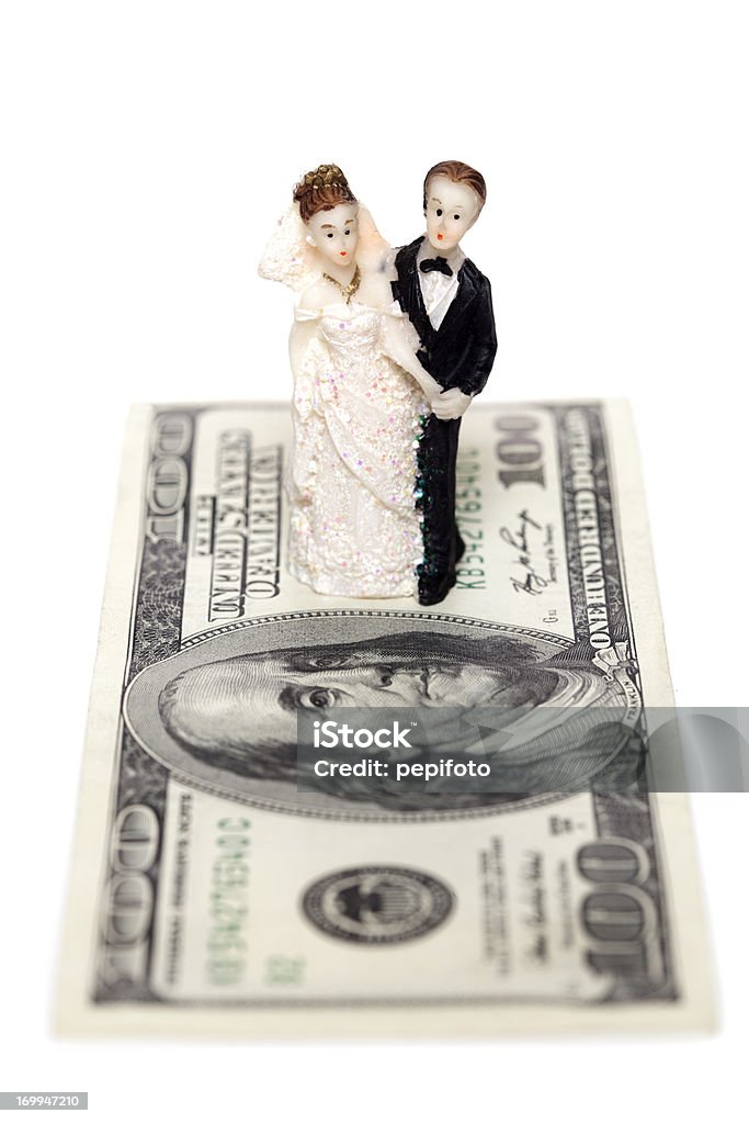 Wedding couple Wedding couple standing on a Dollar isolated on white background Currency Stock Photo