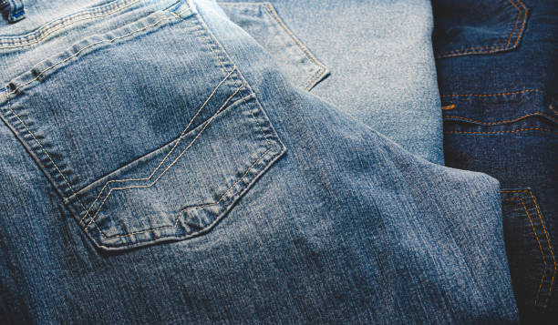 istock Folded denim blue jeans close up. 1699476886