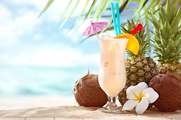 Pina Colada cocktail on the beach with copy space Pina Colada cocktail on the beach with copy space tropical drink stock pictures, royalty-free photos & images