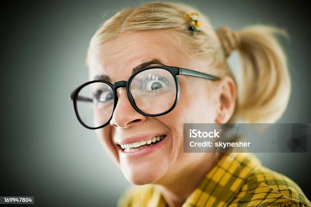 Closeup Of A Smiling Nerd Wearing Glasses Stock Photo - Download Image Now  - Nerd, Women, One Woman Only - iStock