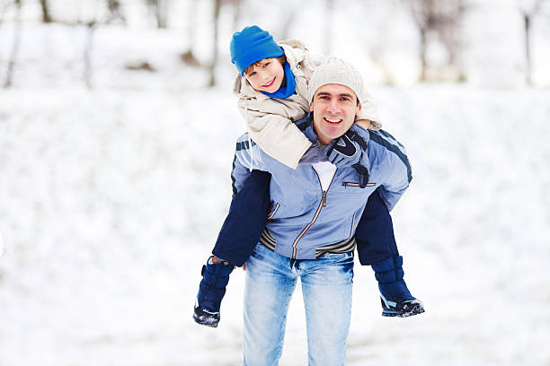 istock Father giving his son a piggyback ride. 169949379