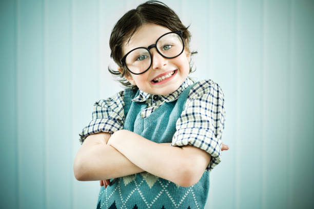 istock Cute nerd boy is smiling and looking at the camera. 169949401