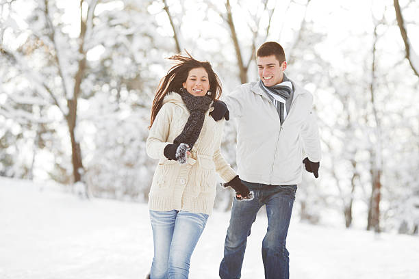istock Young couple running on a winter day. 169949449