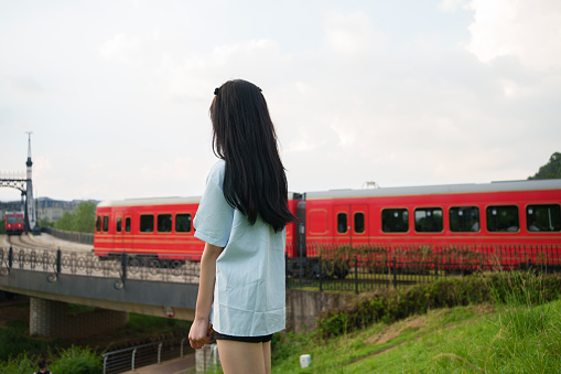 girl watching train
