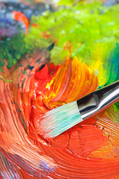 istock Paintbrush with oil paint on a classical palette 169949687