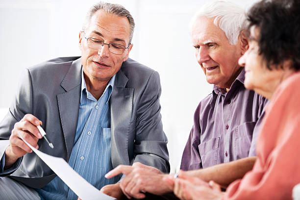 istock Senior couple meeting with financial advisor 169949892