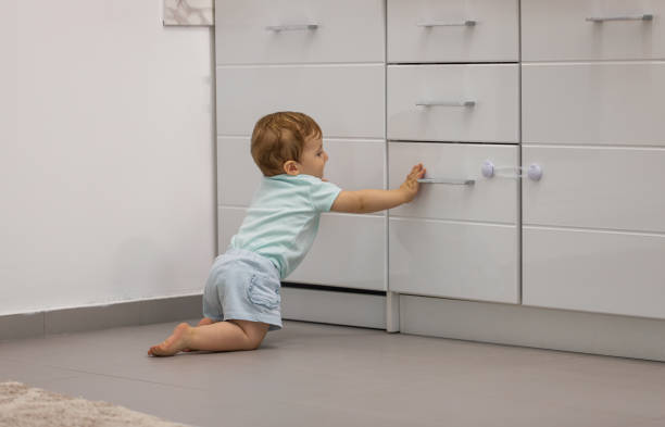 istock Baby girl discovering kitchen space 1699504532