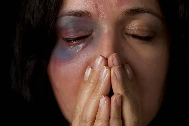 Domestic violence victim, a young woman being hurt