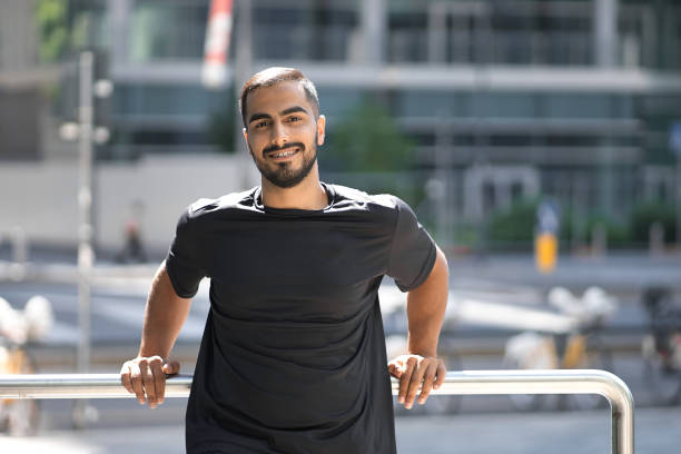 istock Portrait of smiling middle eastern confident man smiling and looking at camera 1699518943