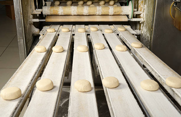 Production line of burger breads stock photo