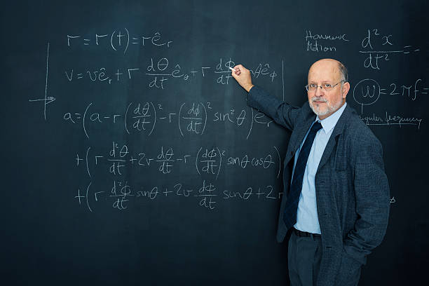 istock Science teacher writting at blackboard physics equation 169952339