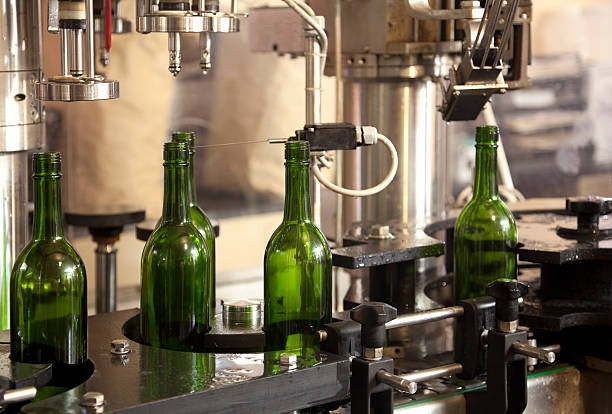 istock Automated Wine Bottling on Conveyor Belt in Factory 169953890
