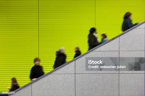 Civilians Riding An Escalator With A Green Screen Background Stock Photo - Download Image Now
