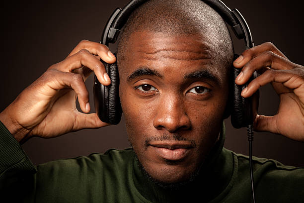 istock Young man listening to music 169954191
