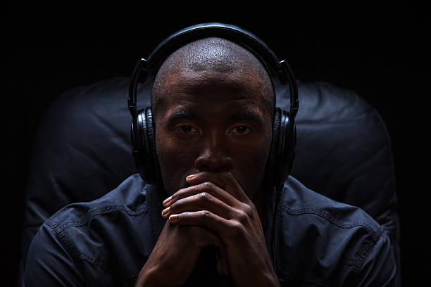 istock Man Intensely Listening to Music 169954206