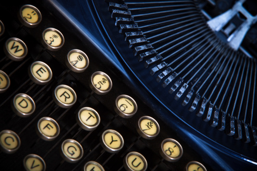 Close-up shot of keys and type bars on a vintage portable manual typewriter
