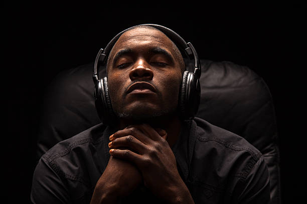 Man Focused on Listening to Music
