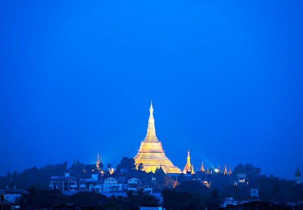 The Shwedagon Pagoda (Shwedagon Paya) in Yangon, Myanmar at sunrise.