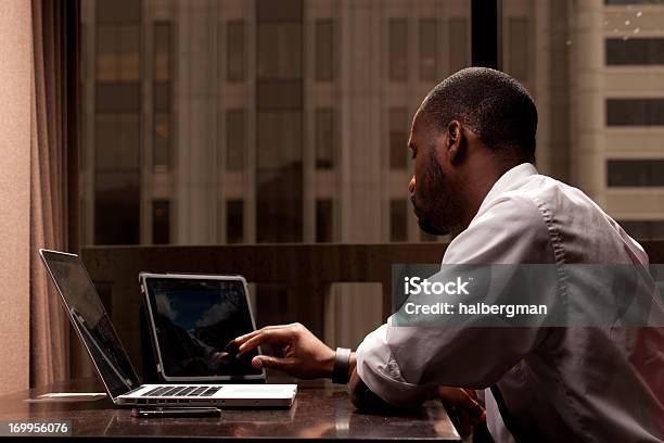 Man Working On A Tablet Pc Stock Photo - Download Image Now - African Ethnicity, African-American Ethnicity, Black Color