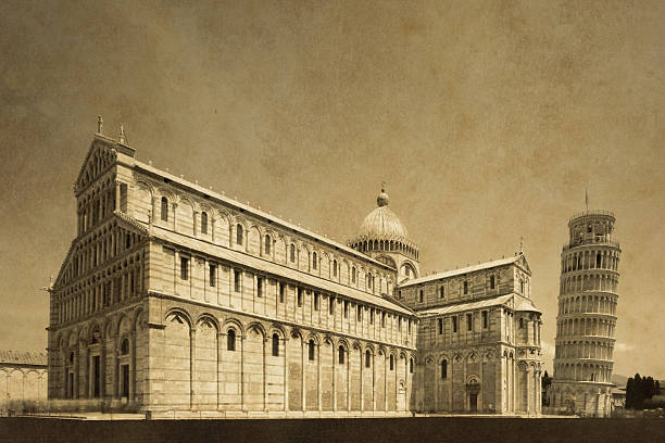 The Cathedral and The Leaning Tower of Pisa at the Miracle Square, Italy. Long exposure shot (2-3mins to make the people blurred and unrecognizable), converted to monochrome, added textures and noise for the vintage look.