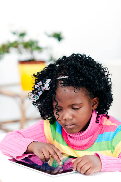 istock Little girl working on tablet 169957812
