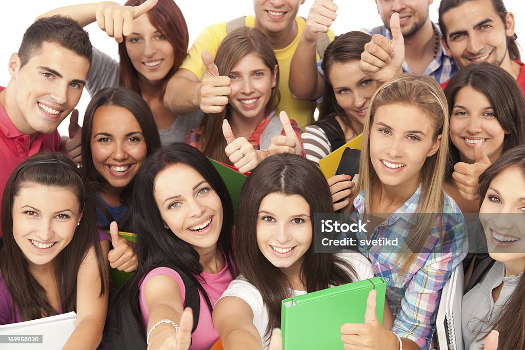 Group of young people showing thumb up. Large group of young people smiling and showing thumb up.See more STUDENTS or YOUNG PEOPLE TOGETHER images ISOLATED on white or INDOORS. Click on image below for lightbox. Cut Out Stock Photo
