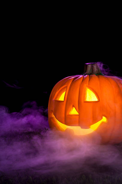 istock Bright jack o lantern in a foggy background 169958718