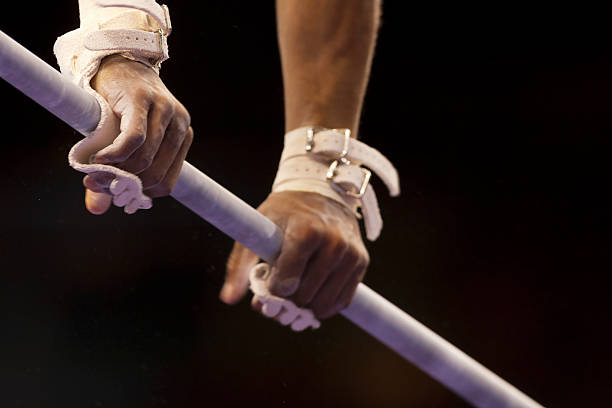 istock Male Gymnast's hands on high bar 169958750