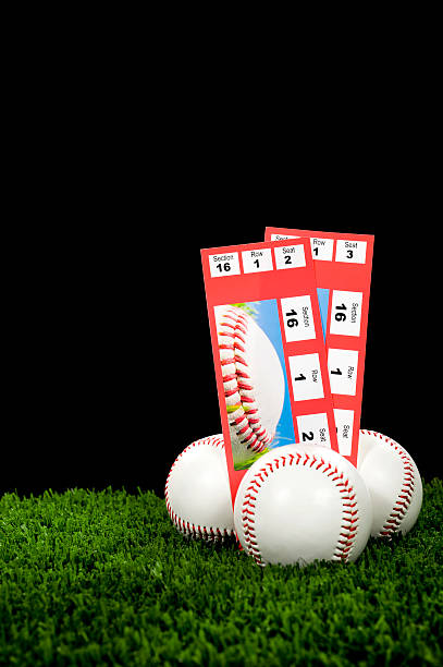 istock Two Baseball Tickets stubs, with new baseballs - Night Game 169958827