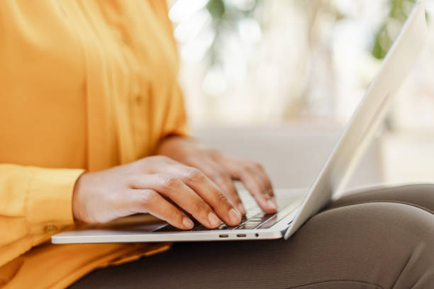 istock Business woman, freelancer, copywriter hands typing on keyboard working online, planning project sitting in modern office. Female shopping online, ordering food, selective focus. 1699593489