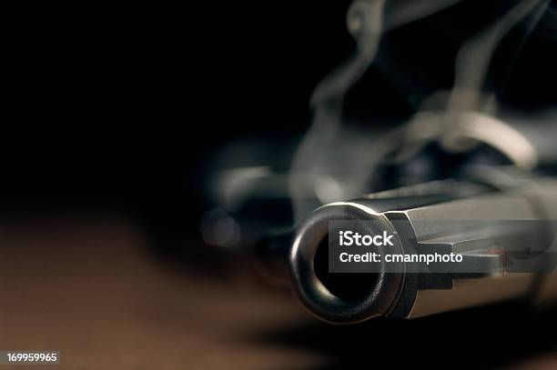 Smoking Gun Lying On The Floor Revolver Stock Photo - Download Image Now - Gun, Handgun, Pistol