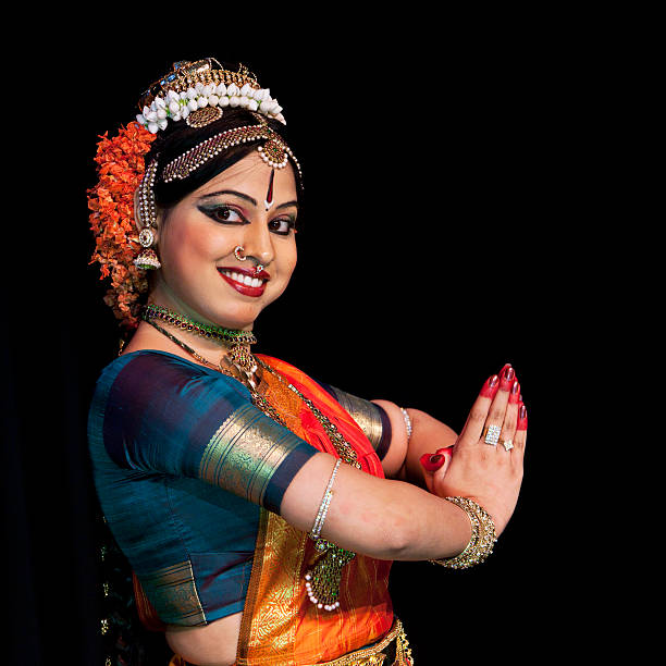 istock Young Indian woman dancing traditional dance. 169960422