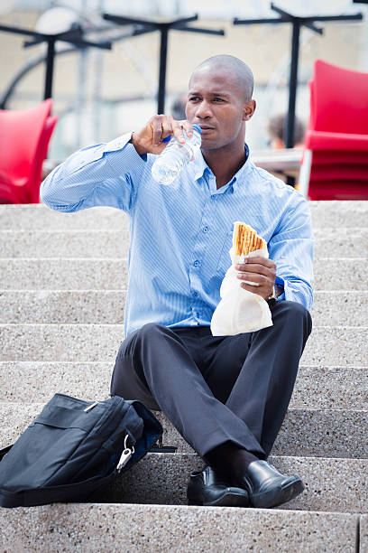 istock Office worker eating lunch outdoors 169960628