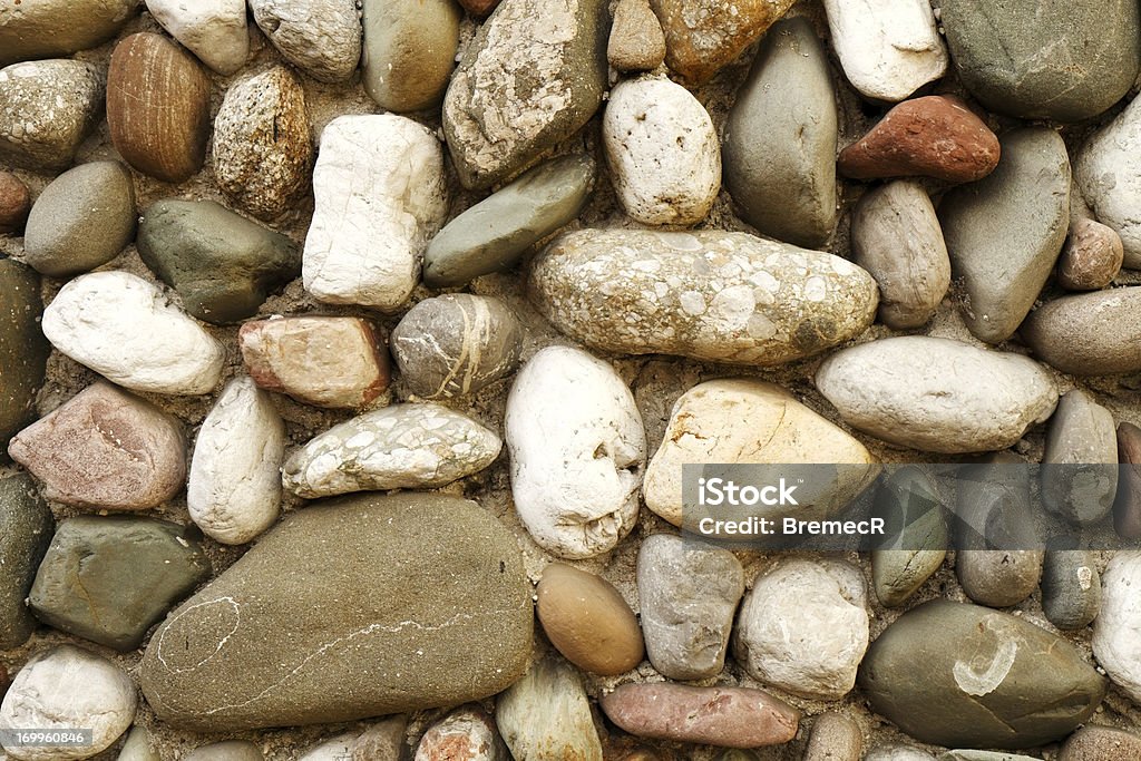 Wall decorated with colorful stone Wall decorated with colorful stones of different sizes and shapes. Building Exterior Stock Photo