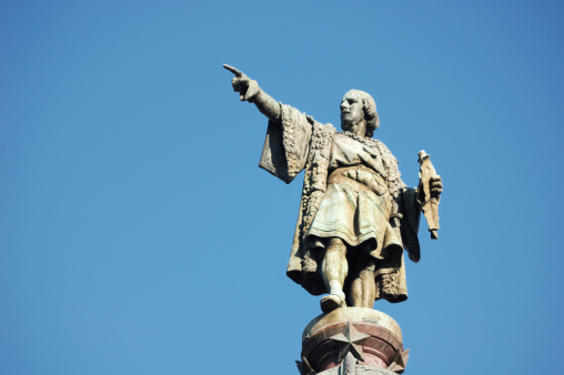 London, United Kingdom – February 08, 2018: A statue of Roman Emperor Trajan with remains of London Wall which was first built by the Romans in the 2nd and 3rd Centuries AD.