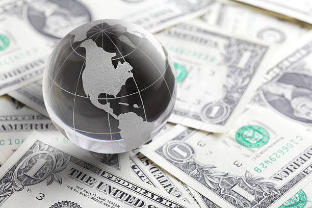istock glass globe and money 169961097