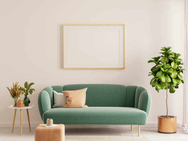 istock Mock up poster frame in Scandinavian style interior with green velvet sofa 1699612484