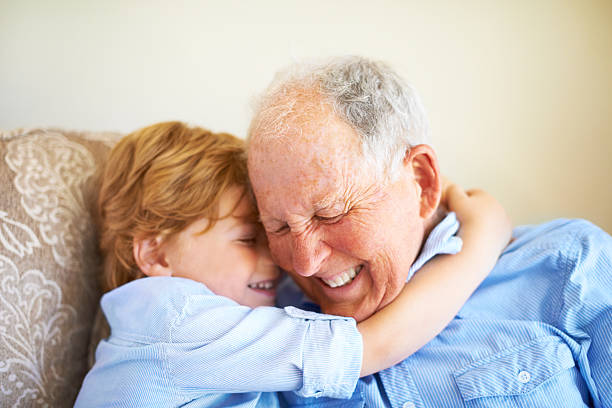 busca el mejor grandad - whispering grandparent child grandfather fotografías e imágenes de stock